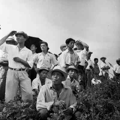 Crowd of Japanese civilians observing an aerial display