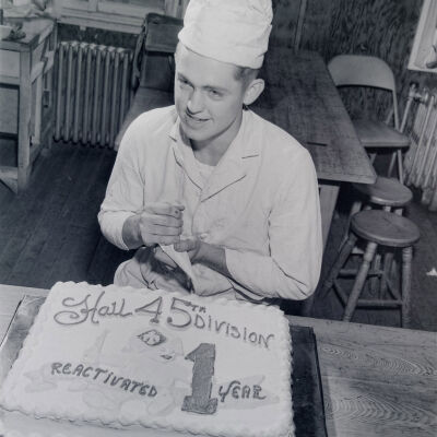 Cook with a cake celebrating 45th Division one year of reactivation