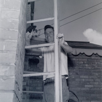 Soldier washing windows