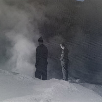 Two soldiers observing a steaming spring