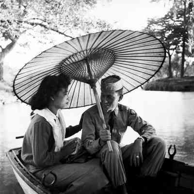 Soldier and a Japanese woman sharing a rowboat