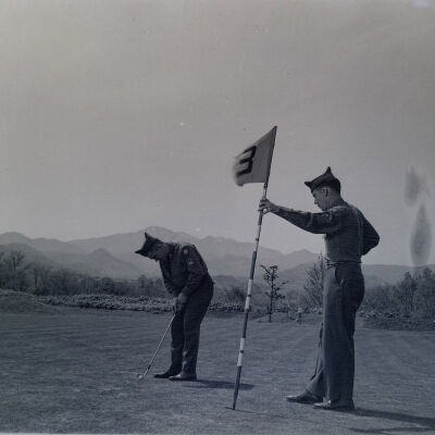 Soldiers playing golf