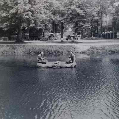 Soldiers in an inflatable raft on a lake