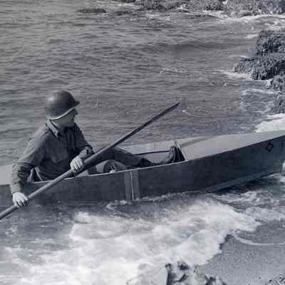 Soldiers with homemade canoe