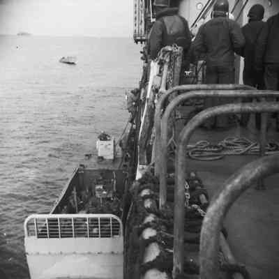 Soldiers climbing into landing craft