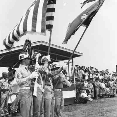 Soldiers holding flags during a military parade or ceremony