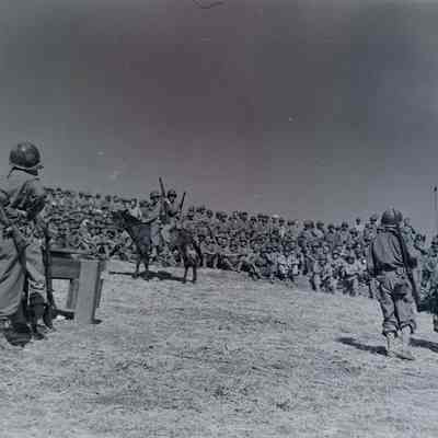 Large crowd of soldiers watching entertainers