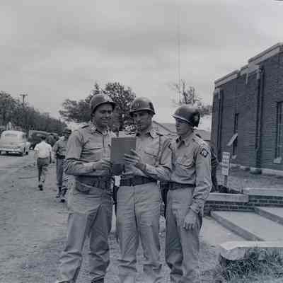 Soldiers looking at a clipboard