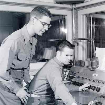 Soldiers inside a broadcasting booth