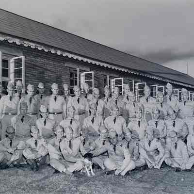 Group of soldiers in front of barracks