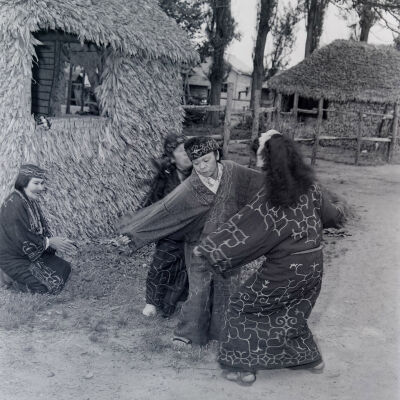 Ainu men and women dancing
