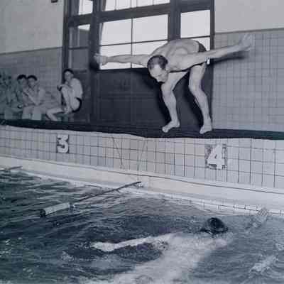 Soldiers swimming in an indoor pool