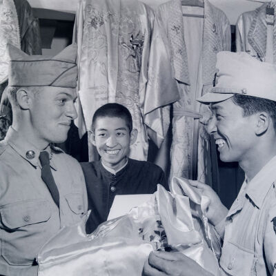 Soldier and a member of the Japanese National Police Reserve shop for silk kimonos