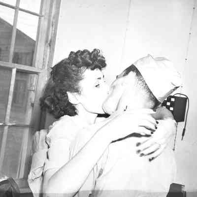 Soldier and woman kissing
