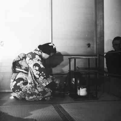 Soldiers and Japanese civilians at a tea ceremony