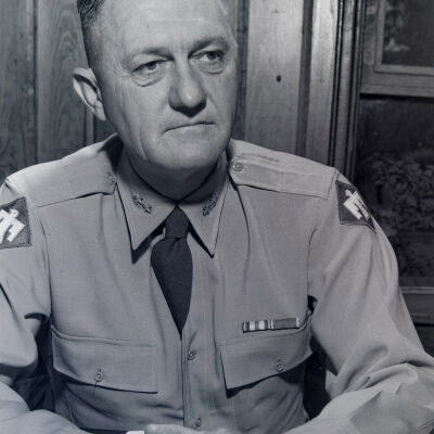 General Styron posed at desk