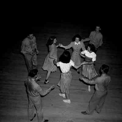 Soldiers dancing with girls