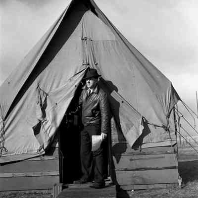 Man stepping out of a tent