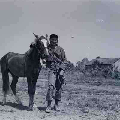 Soldier posed with horse