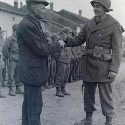 Soldier receiving the key to a liberated French town
