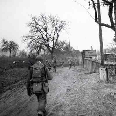 Soldiers marching into town