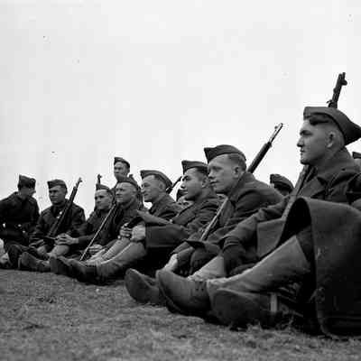 Soldiers resting in a field
