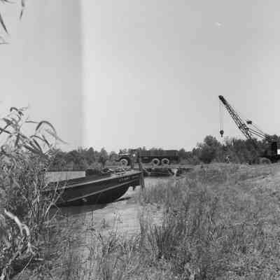 Truck parked on pontoon bridge section