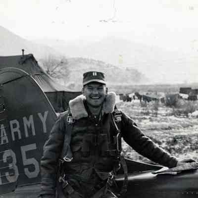 Pilot Poses in front of his Plane
