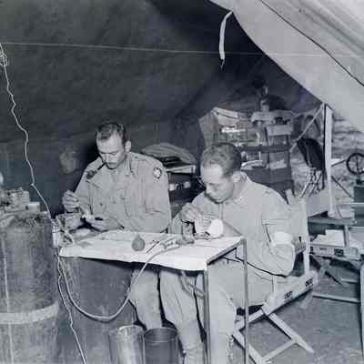 Soldiers making false teeth
