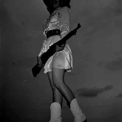 Majorette holding a rifle