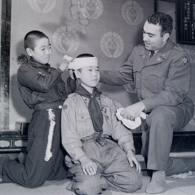 Soldier with two Japanese Boy Scouts