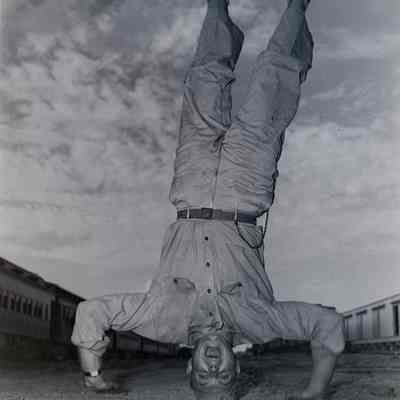 Soldier standing on his head