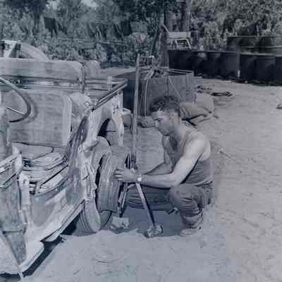 Soldier changing a tire