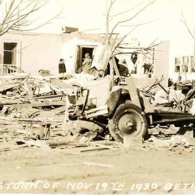 Woman and child standing in rubble