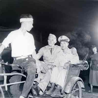 Night scene: soldiers, Japanese National Police Reservist, and Japanese women