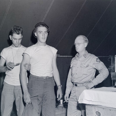 Soldier in tent receiving inoculation