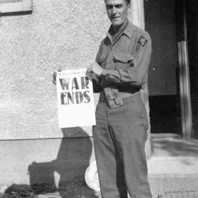 Soldier holding newspaper