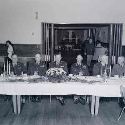 General Styron and others at the head table of a banquet