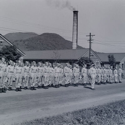 Soldiers in formation in front of barracks