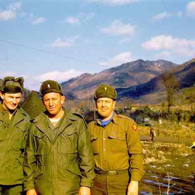 Group of officers with mountains in background