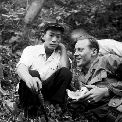 Japanese boy and soldier sharing a melon