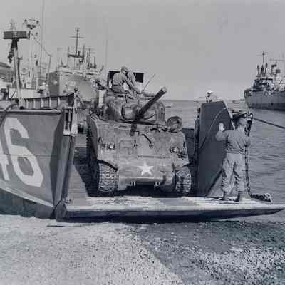 Driving a tank off of a beach landing craft