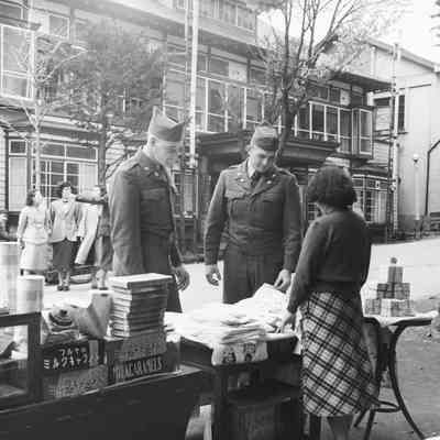 Soldiers shopping at an outdoor market