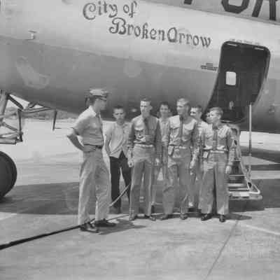Soldiers standing in front of C-97 aircraft