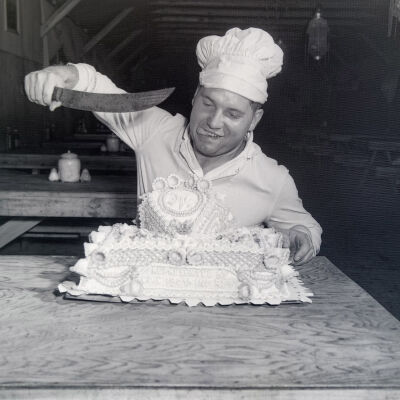 Cook about to cut a cake