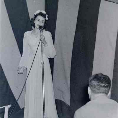 Woman singing on stage
