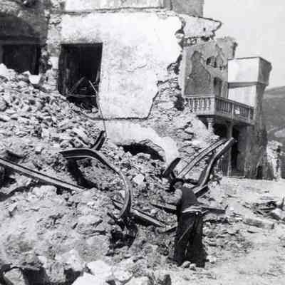 Man Rummaging through Debris