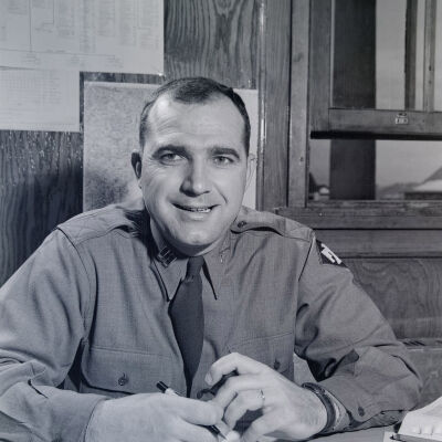 Portrait of unknown officer at desk