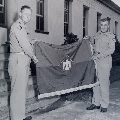 General Styron displaying a 45th Infantry Division flag