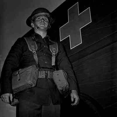 Medic standing beside ambulance